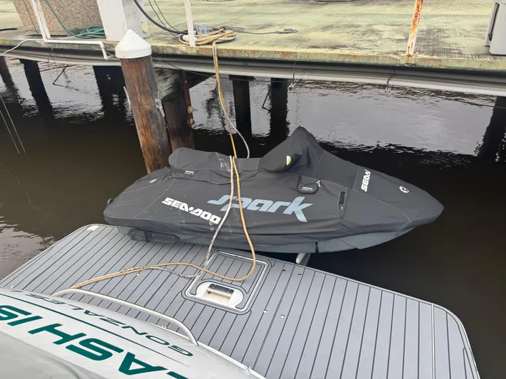Cash Is King Yacht Photos Pics Covered Sea-Doo Spark jet ski docked beside a 2002 Formula 40 PC boat.