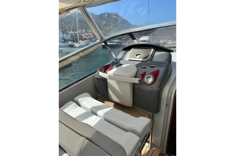  Yacht Photos Pics Interior of 2008 Custom Teorema 42 ROSSOCORSA yacht with modern dashboard and seating.