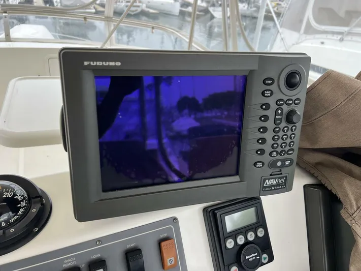 Yacht Z Yacht Photos Pics Furuno navigation system on 1998 Riviera 48 Convertible yacht dashboard.