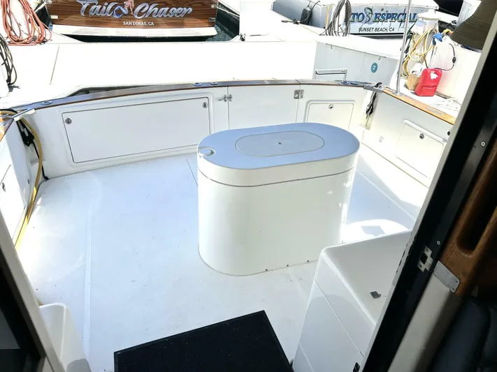 Yacht Z Yacht Photos Pics 1998 Riviera 48 Convertible yacht deck with storage and seating area.