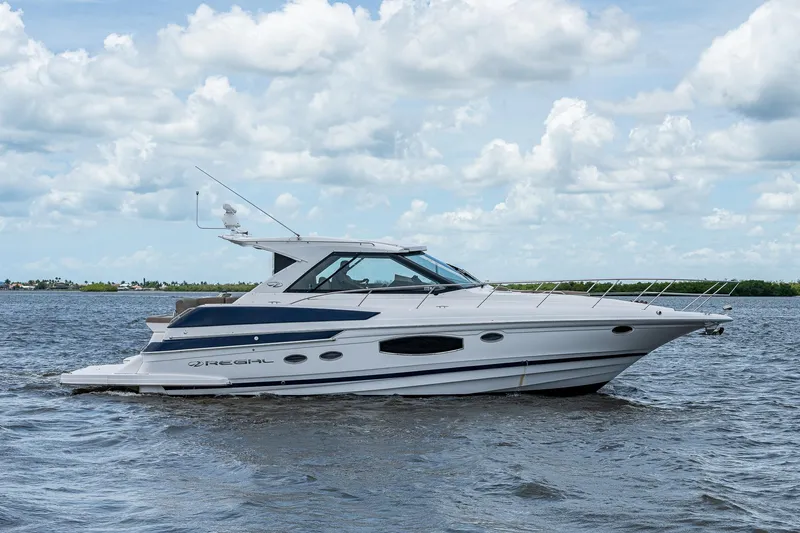 R&r III Yacht Photos Pics 2015 Regal 46 Sport Coupe yacht on open water under a cloudy sky.