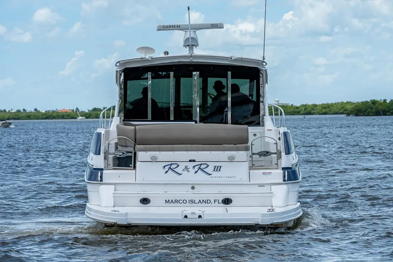 R&r III Yacht Photos Pics 2015 Regal 46 Sport Coupe yacht cruising on water near Marco Island, FL.