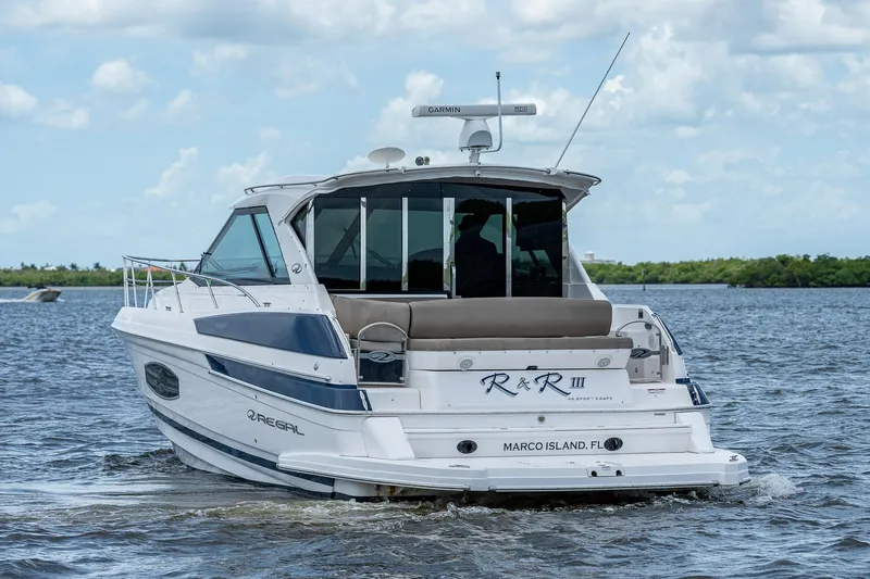 R&r III Yacht Photos Pics 2015 Regal 46 Sport Coupe yacht cruising on water.