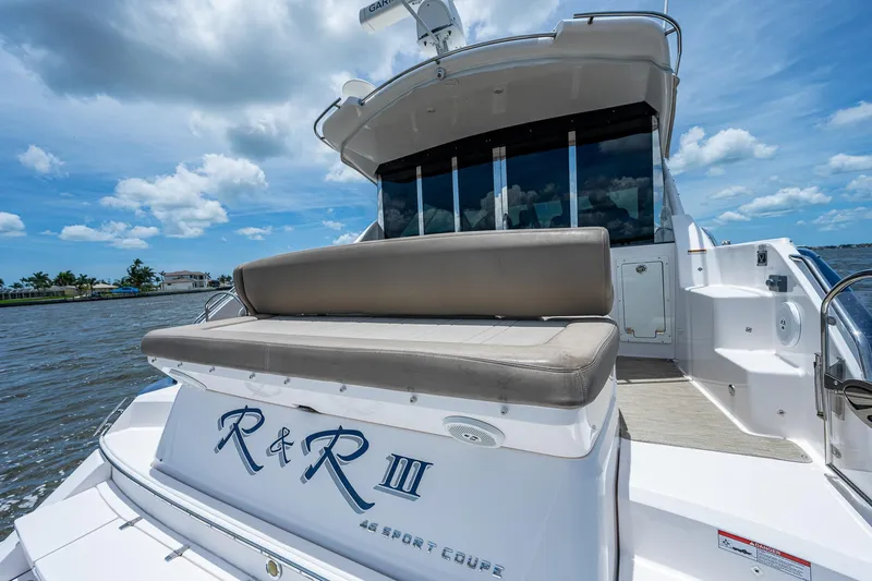 R&r III Yacht Photos Pics 2015 Regal 46 Sport Coupe yacht with rear seating on a sunny day.