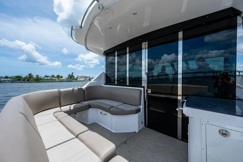R&r III Yacht Photos Pics 2015 Regal 46 Sport Coupe yacht with spacious outdoor seating area.
