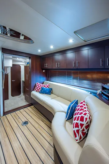 R&r III Yacht Photos Pics Interior of 2015 Regal 46 Sport Coupe with modern seating and wooden flooring.
