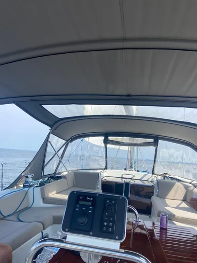 Padraigin II Yacht Photos Pics 2016 Jeanneau 58 yacht interior with helm, canopy, and ocean view.