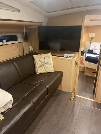 Padraigin II Yacht Photos Pics Interior of 2016 Jeanneau 58 yacht with leather seating and modern decor.