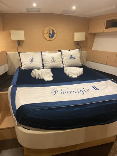 Padraigin II Yacht Photos Pics Luxurious bedroom interior of 2016 Jeanneau 58 yacht with elegant bedding and decor.