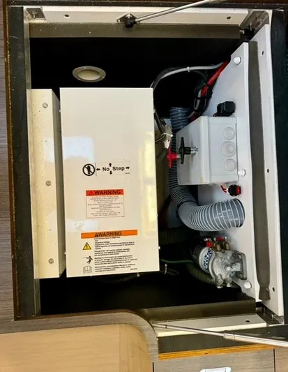 Padraigin II Yacht Photos Pics Electrical compartment of a 2016 Jeanneau 58 yacht, featuring wiring and safety warnings.