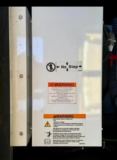 Padraigin II Yacht Photos Pics Electrical panel with warning labels on a 2016 Jeanneau 58 yacht.