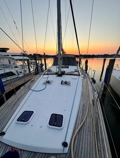 Padraigin II Yacht Photos Pics 2016 Jeanneau 58 yacht docked at sunset, showcasing sleek deck design.