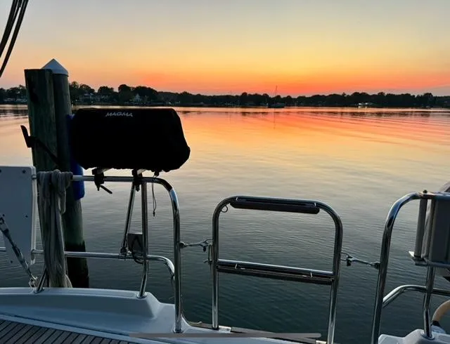 Padraigin II Yacht Photos Pics Jeanneau 58 yacht at sunset, tranquil waters, 2016 model.