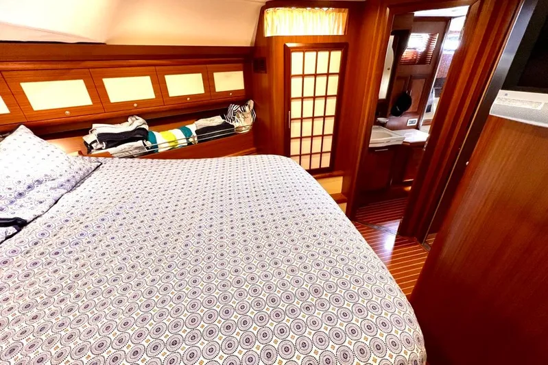 Mamma Mia Yacht Photos Pics Luxurious cabin interior of 2006 Mochi Craft 51 Dolphin yacht with patterned bedding.