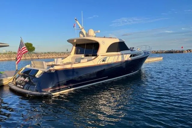 Mamma Mia Yacht Photos Pics Luxury 2006 Mochi Craft 51 Dolphin yacht docked in serene waters.