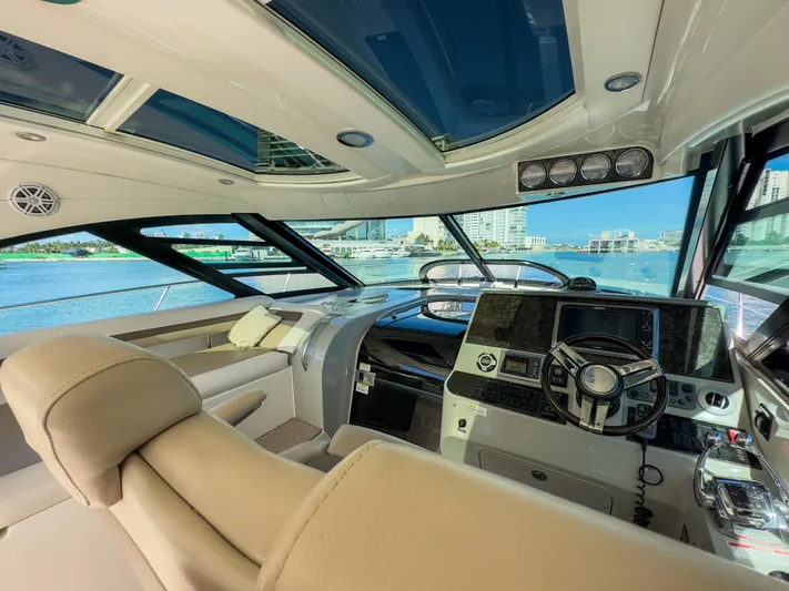 2013 Sea Ray 470 Sundancer @ Cancun Yacht Photos Pics Luxurious interior of 2013 Sea Ray 470 Sundancer yacht with modern helm and panoramic windows.