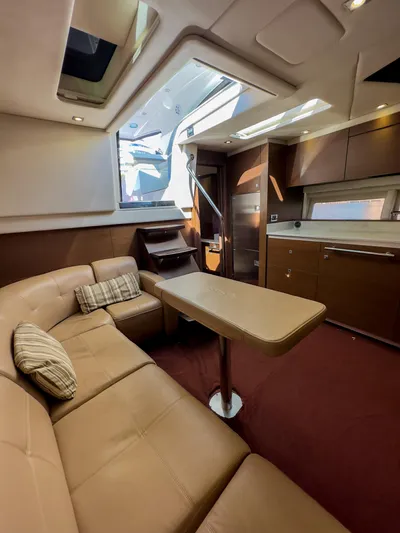 2013 Sea Ray 470 Sundancer @ Cancun Yacht Photos Pics Luxurious interior of 2013 Sea Ray 470 Sundancer yacht with leather seating and modern kitchen.