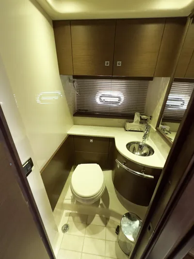 2013 Sea Ray 470 Sundancer @ Cancun Yacht Photos Pics Luxurious bathroom in 2013 Sea Ray 470 Sundancer yacht with modern fixtures and wood cabinetry.