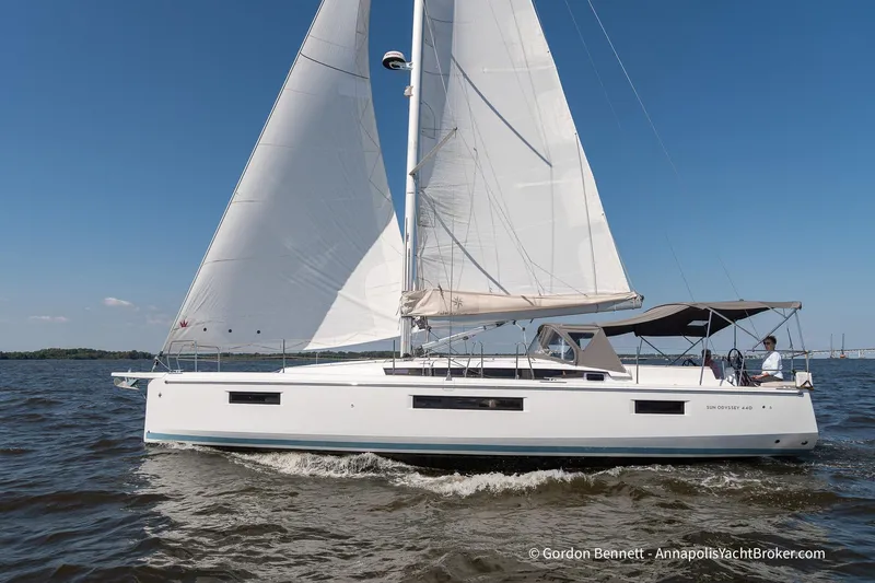 No Regrets Yacht Photos Pics 2019 Jeanneau Sun Odyssey 440 sailing on open water under clear blue sky.