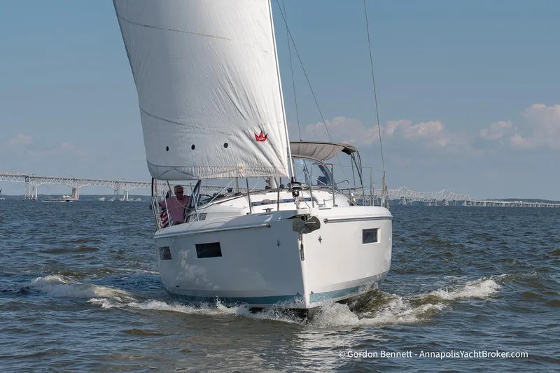 No Regrets Yacht Photos Pics 2019 Jeanneau Sun Odyssey 440 sailing on open water with bridge in background.