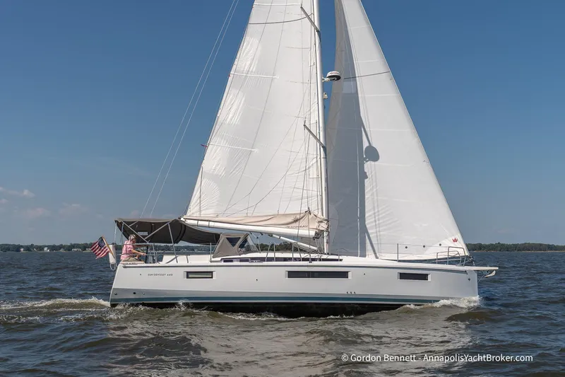 No Regrets Yacht Photos Pics 2019 Jeanneau Sun Odyssey 440 sailing on open water under clear blue skies.