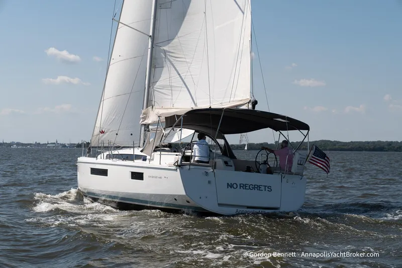 No Regrets Yacht Photos Pics 2019 Jeanneau Sun Odyssey 440 sailing on open water, displaying "No Regrets" on the stern.
