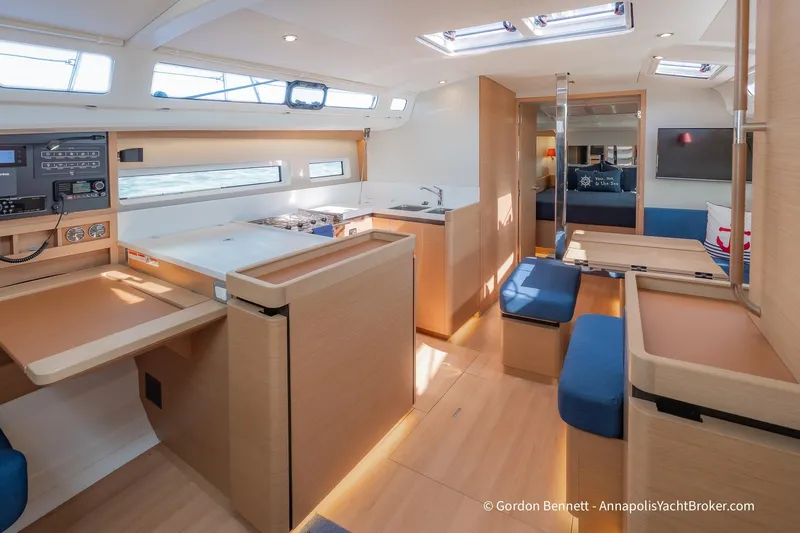 No Regrets Yacht Photos Pics Interior of 2019 Jeanneau Sun Odyssey 440 yacht, featuring modern kitchen and seating area.