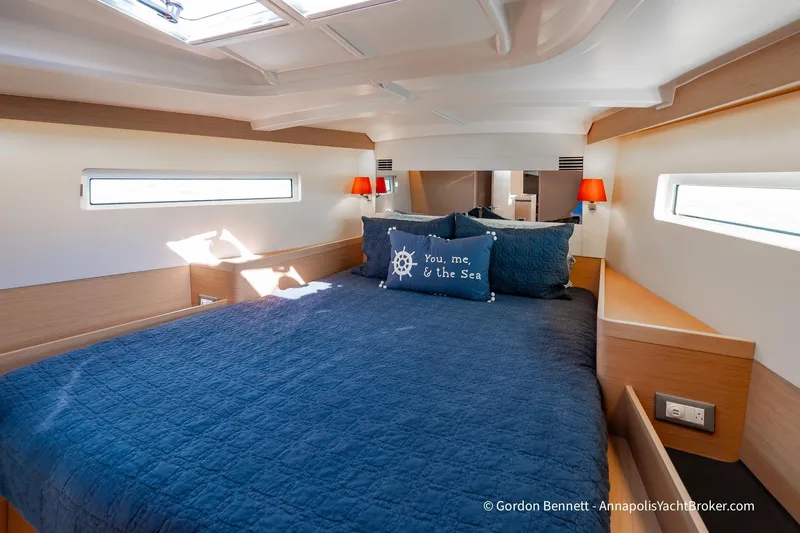 No Regrets Yacht Photos Pics Luxurious cabin interior of 2019 Jeanneau Sun Odyssey 440 yacht with cozy bedding.