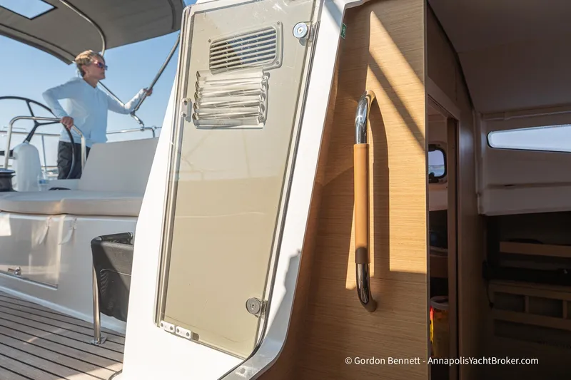 No Regrets Yacht Photos Pics 2019 Jeanneau Sun Odyssey 440 yacht interior with person on deck, showcasing modern design.