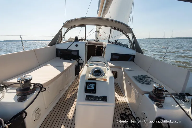 No Regrets Yacht Photos Pics 2019 Jeanneau Sun Odyssey 440 sailboat cockpit with modern navigation equipment and seating.