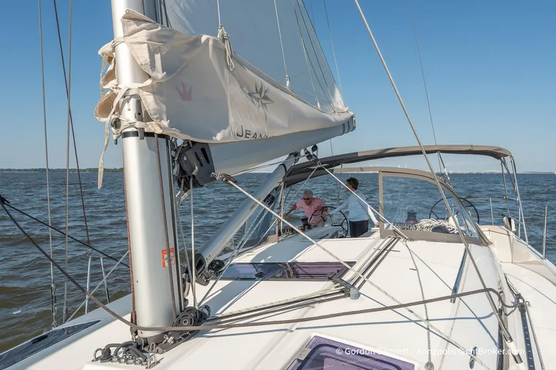 No Regrets Yacht Photos Pics 2019 Jeanneau Sun Odyssey 440 sailing on open water under clear blue sky.