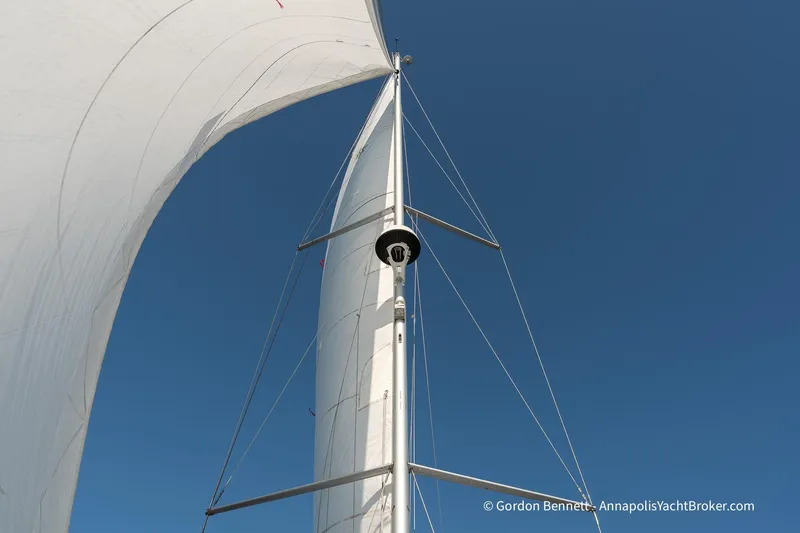 No Regrets Yacht Photos Pics Sail of 2019 Jeanneau Sun Odyssey 440 against clear blue sky.