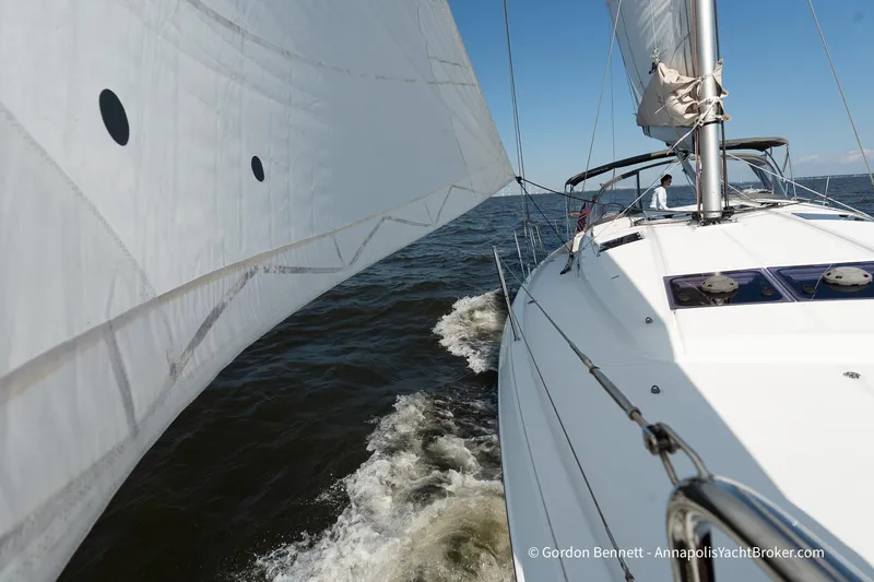 No Regrets Yacht Photos Pics 2019 Jeanneau Sun Odyssey 440 sailing on open water under clear blue skies.