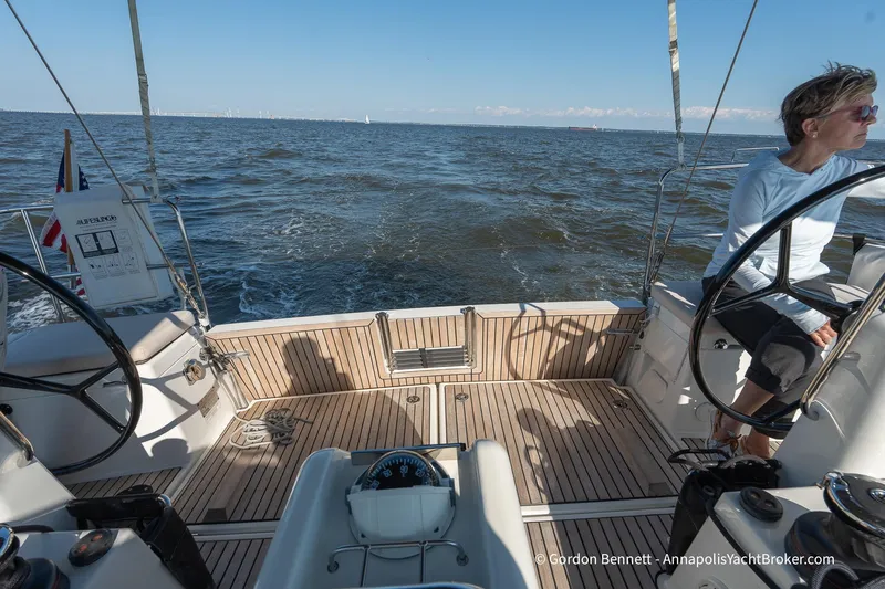 No Regrets Yacht Photos Pics 2019 Jeanneau Sun Odyssey 440 sailing on open water, featuring spacious deck and dual steering wheels.