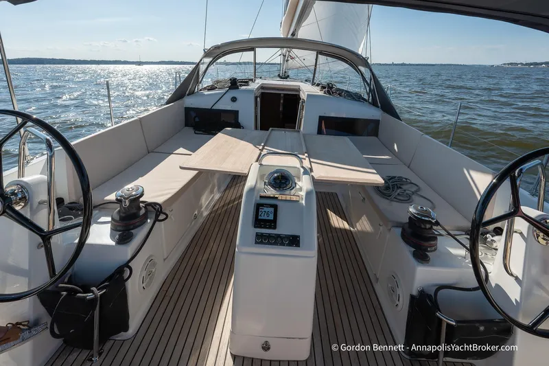 No Regrets Yacht Photos Pics 2019 Jeanneau Sun Odyssey 440 sailboat cockpit with dual steering wheels on open water.