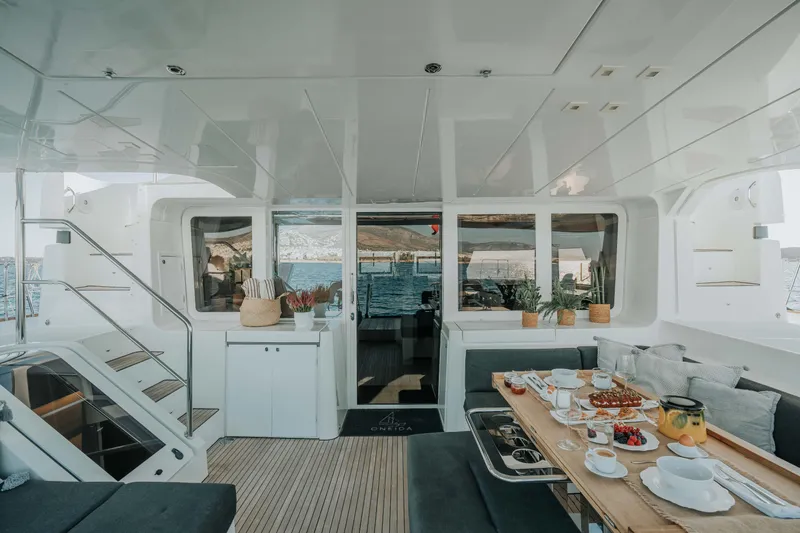  Yacht Photos Pics Luxurious Lagoon 52 yacht interior, 2020 model, featuring elegant dining setup and modern design.