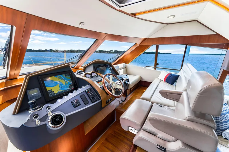 Madrine Yacht Photos Pics Luxurious interior of 2015 Riviera 54 Belize Daybridge yacht with navigation system.