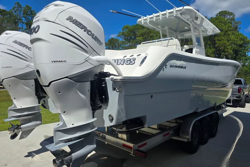 Humble Beginnings Yacht Photos Pics 2022 Invincible 33 Catamaran with twin Mercury Verado engines on a trailer.