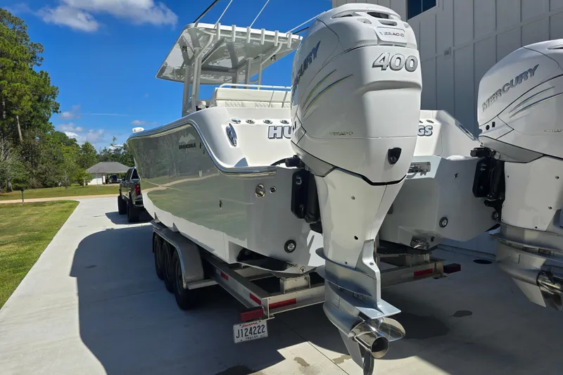 Humble Beginnings Yacht Photos Pics 2022 Invincible 33 Catamaran with dual Mercury 400 engines on trailer.