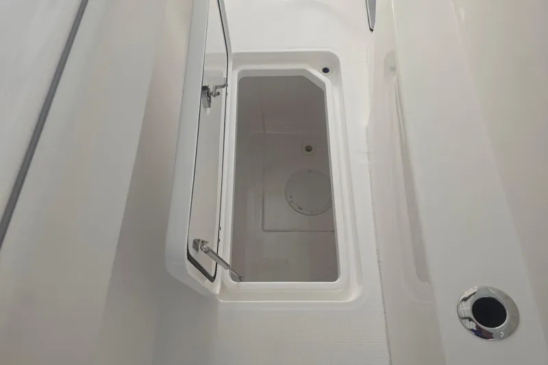Humble Beginnings Yacht Photos Pics Open storage compartment on 2022 Invincible 33 Catamaran boat.