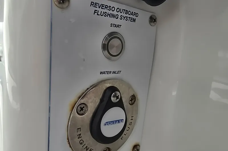 Humble Beginnings Yacht Photos Pics 2022 Invincible 33 Catamaran Reverso outboard flushing system with start button and water inlet.