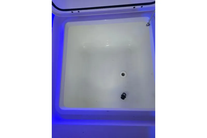 Humble Beginnings Yacht Photos Pics 2022 Invincible 33 Catamaran livewell with blue LED lighting.