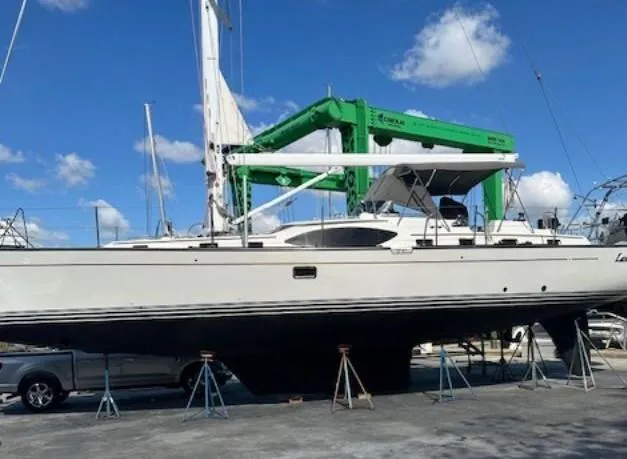 Last Love Yacht Photos Pics Sailboat on stands, 2014 Passport 545 Vista, under clear blue sky.