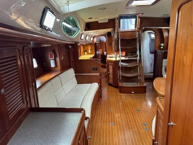 Last Love Yacht Photos Pics Luxurious interior of 2014 Passport 545 Vista yacht with wooden finishes and modern amenities.