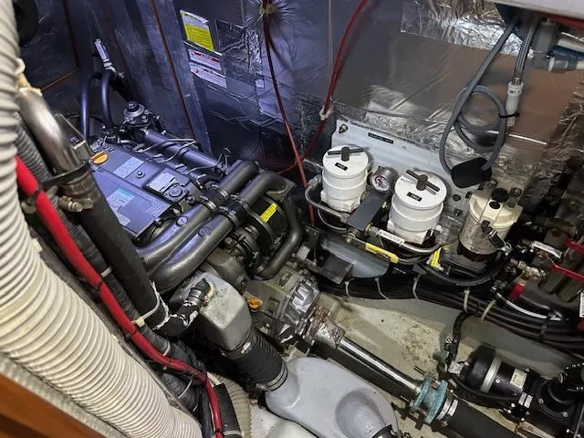 Last Love Yacht Photos Pics Engine room of 2014 Passport 545 Vista yacht, showcasing mechanical components and wiring.