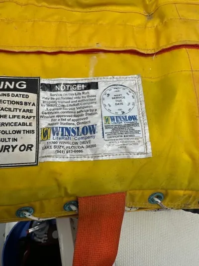 Last Love Yacht Photos Pics Yellow Winslow life raft label with service instructions and contact information.