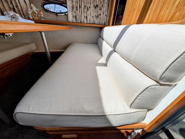 Infinity Bound Yacht Photos Pics Interior seating of 1991 Carver 430 Cockpit Motor Yacht with beige cushions.