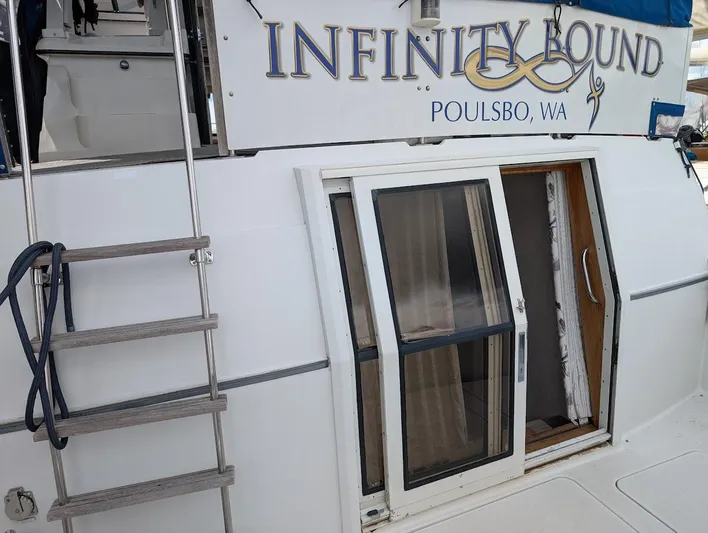 Infinity Bound Yacht Photos Pics 1991 Carver 430 Cockpit Motor Yacht, "Infinity Bound," docked in Poulsbo, WA, with ladder and sliding door.