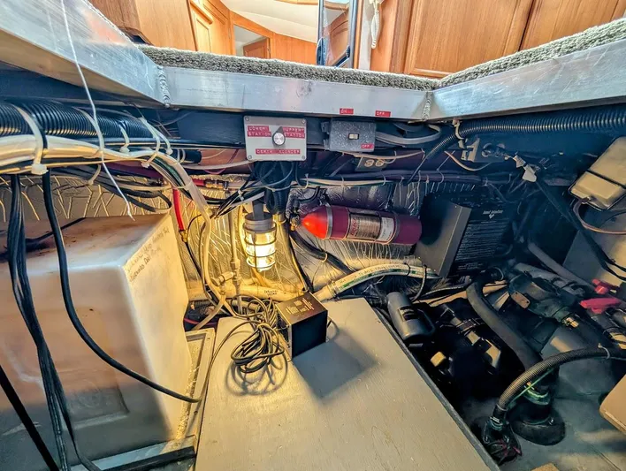 Infinity Bound Yacht Photos Pics Engine room of 1991 Carver 430 Cockpit Motor Yacht with wiring and fire extinguisher.