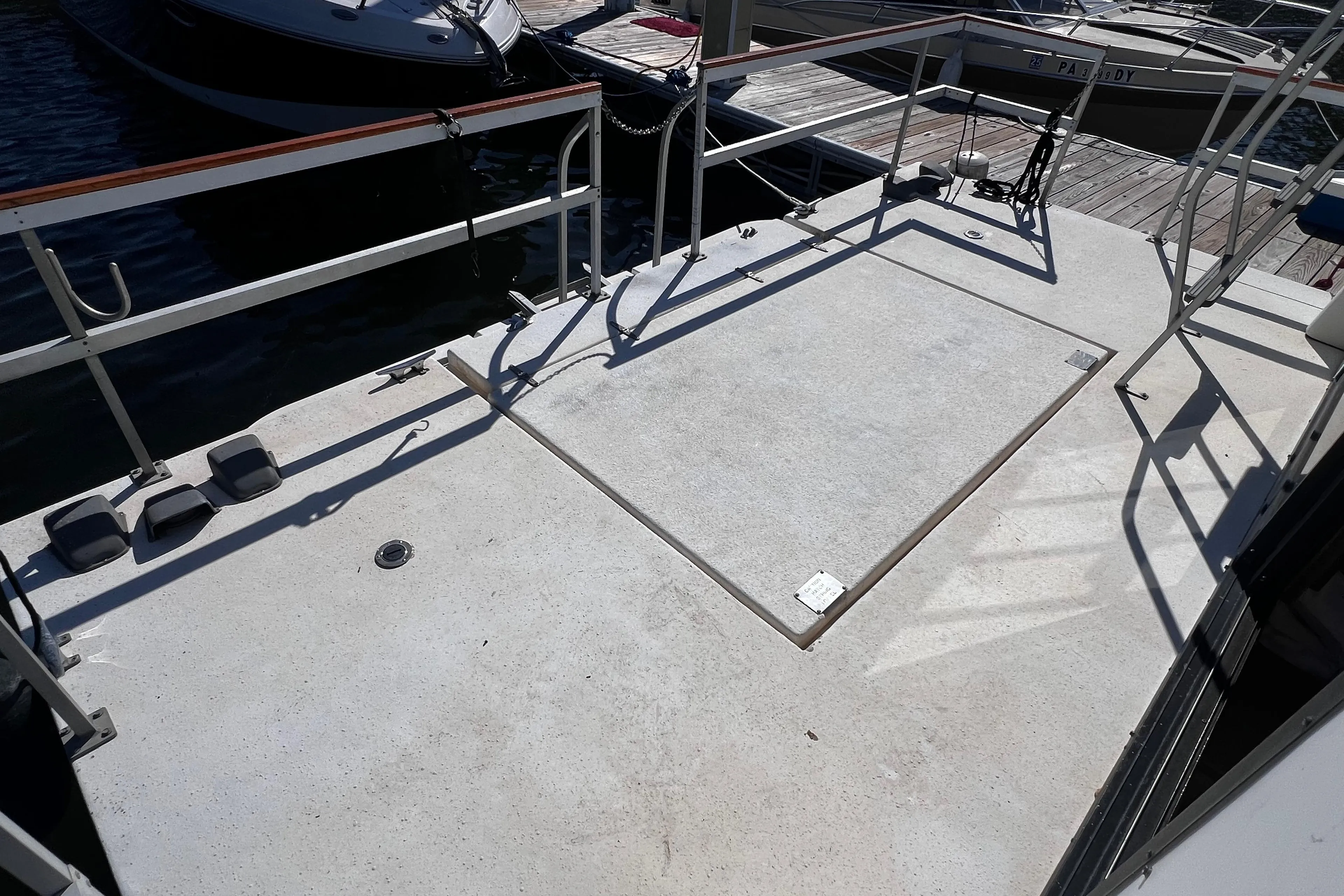 Deck of a 1994 Gibson 44 Classic boat at a marina.